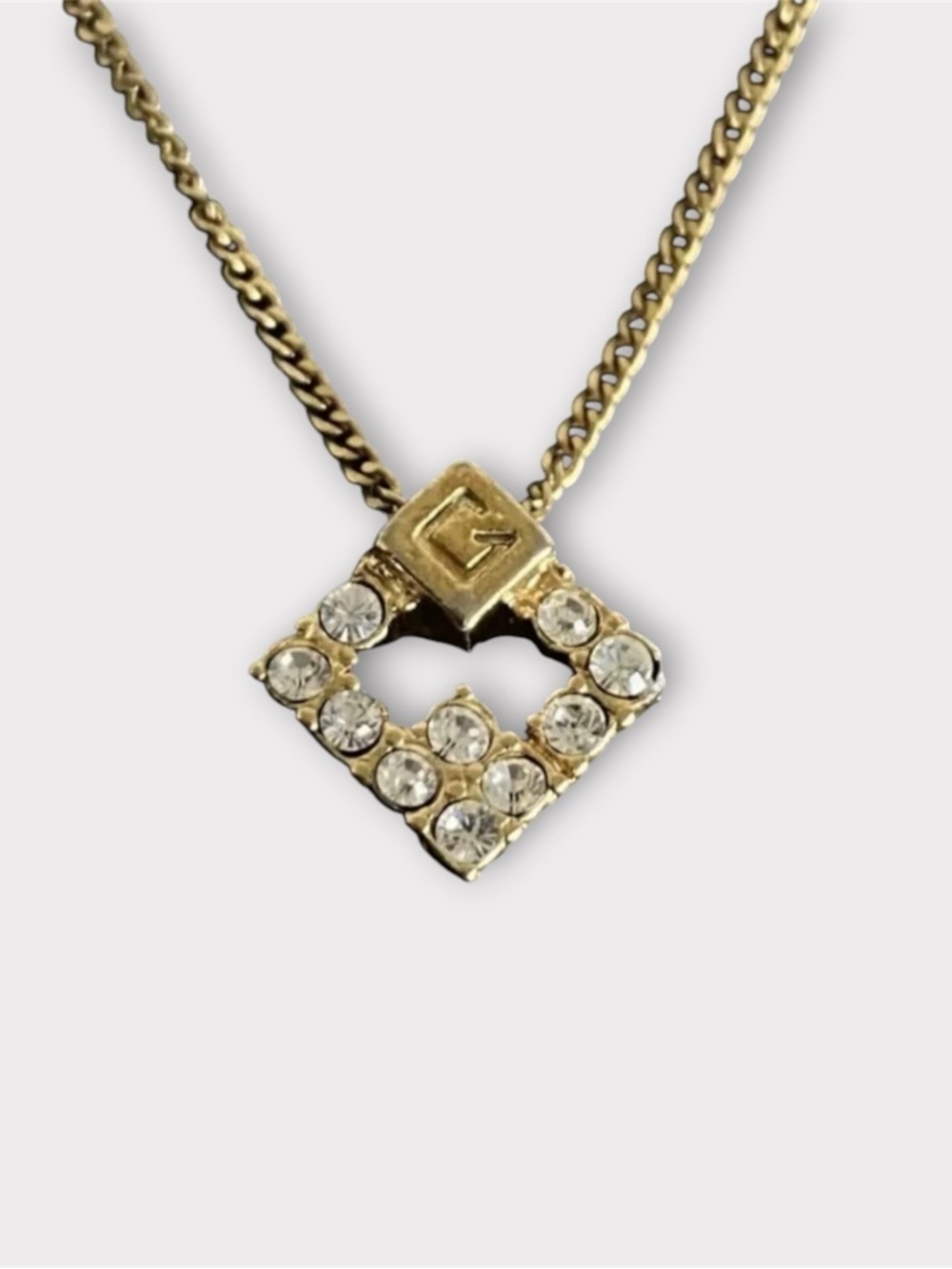 GIVENCHY
Vintage Crystal G Pendant Necklace